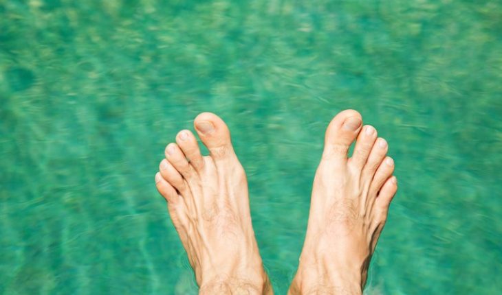 feet hovering over water