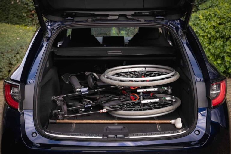 Helping someone with mobility issues get into and out of a car