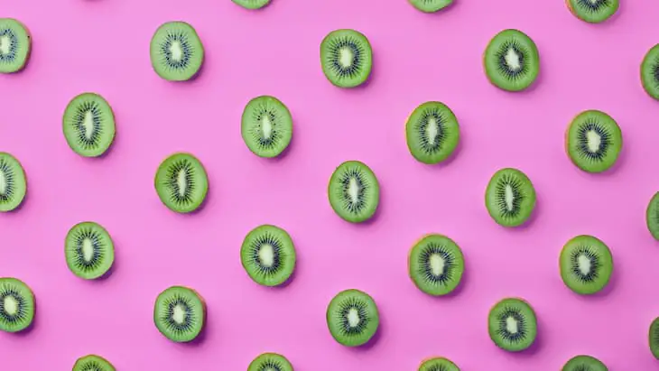 Get your 10-a-day kiwi fruit on pink background