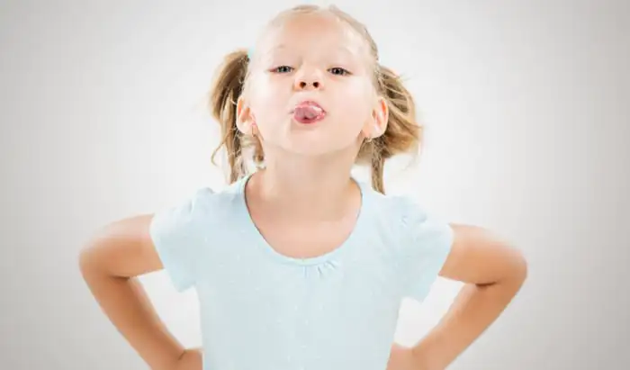 Stopping the spread of childhood bone cancer girl sticking out tongue